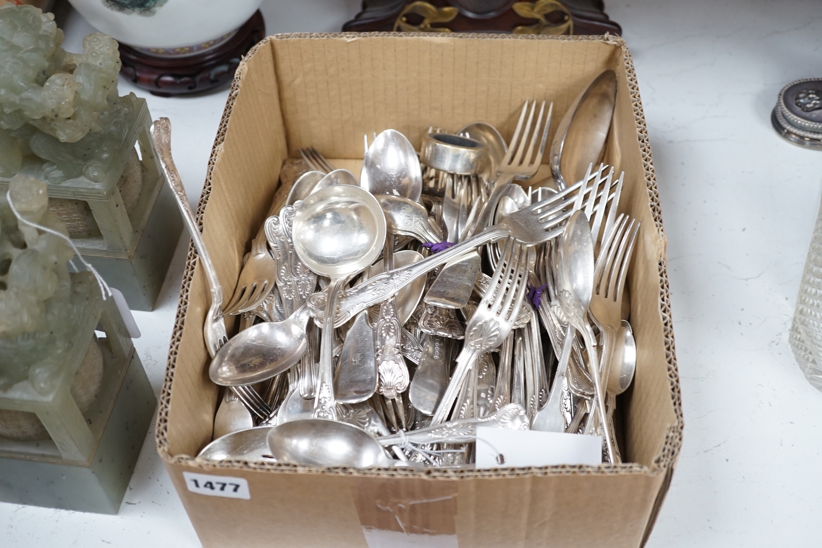 A silver plated part canteen of Kings pattern flatware, a pair of white metal tongs etc